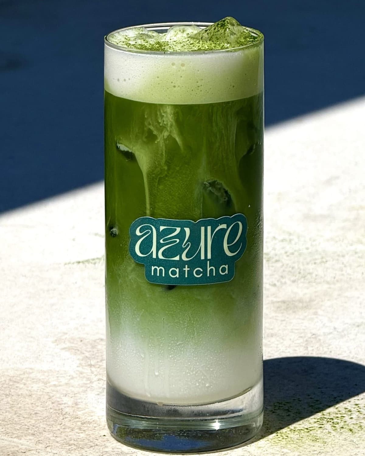 Azure Matcha, iced in a tall glass poolside